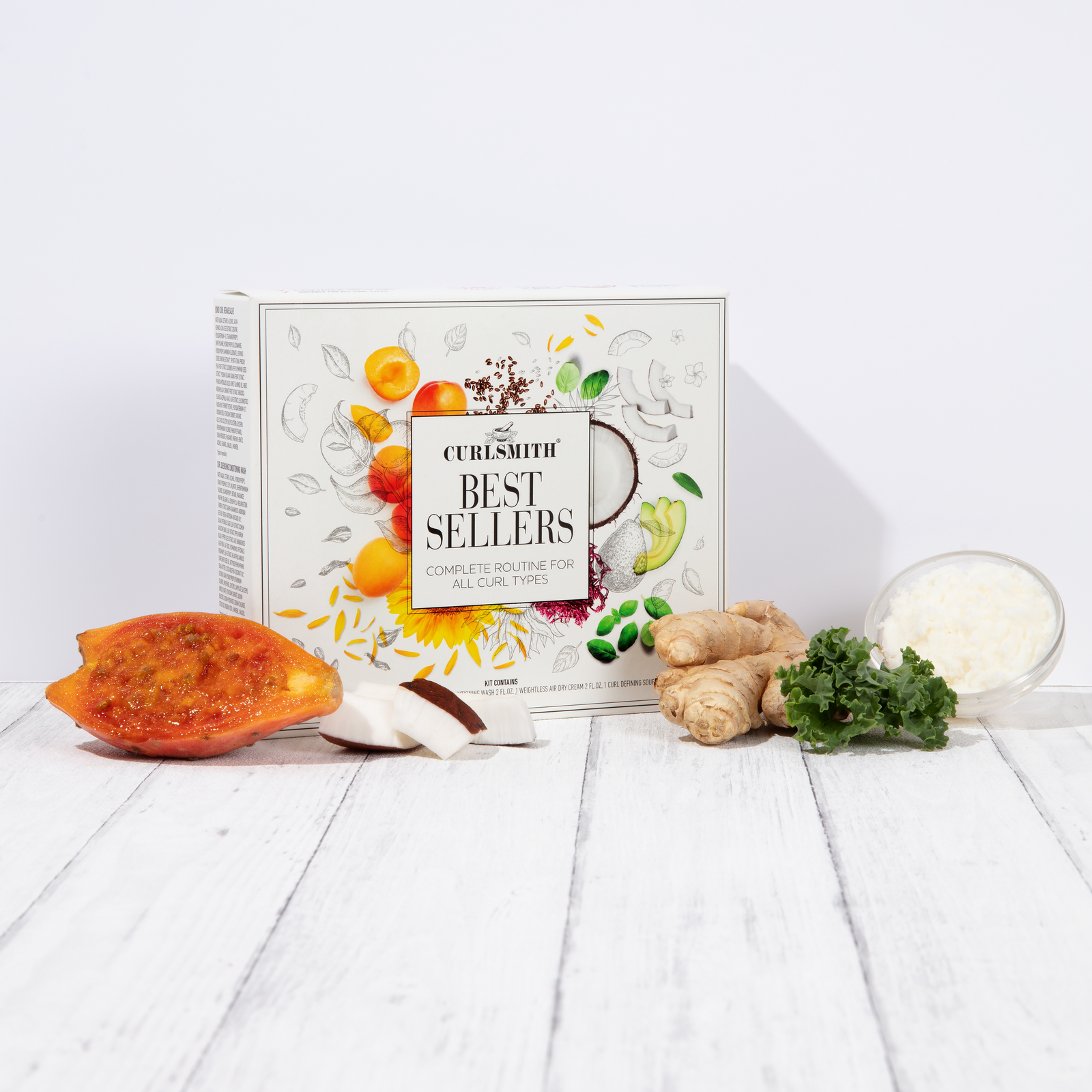Curlsmith Best Sellers box with ingredients on a white wooden surface