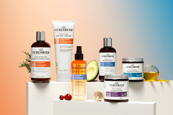 Curlsmith products in front of orange and blue background