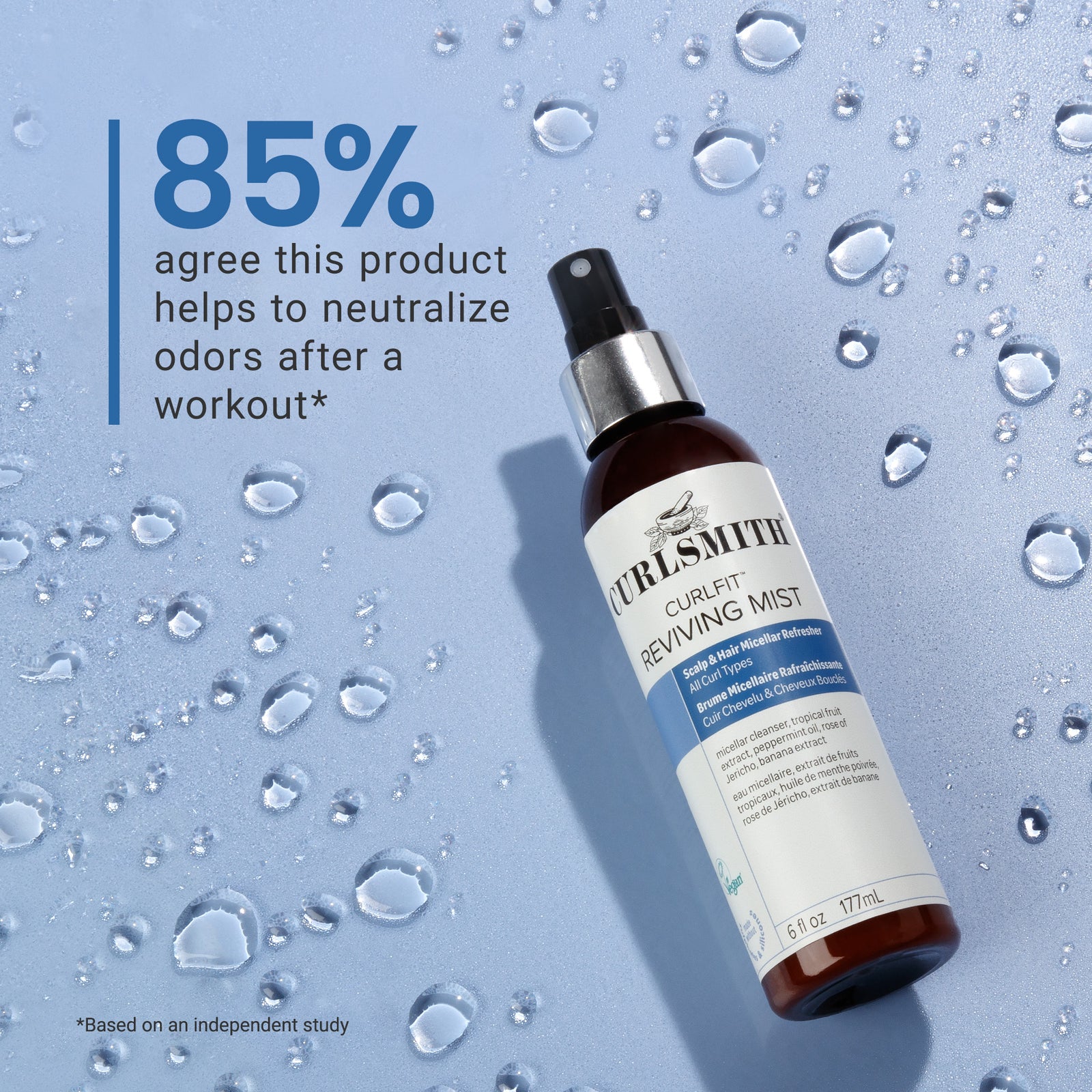 Bottle of Curlsmith Reviving Mist on a blue background with water droplets, Click to enlarge
