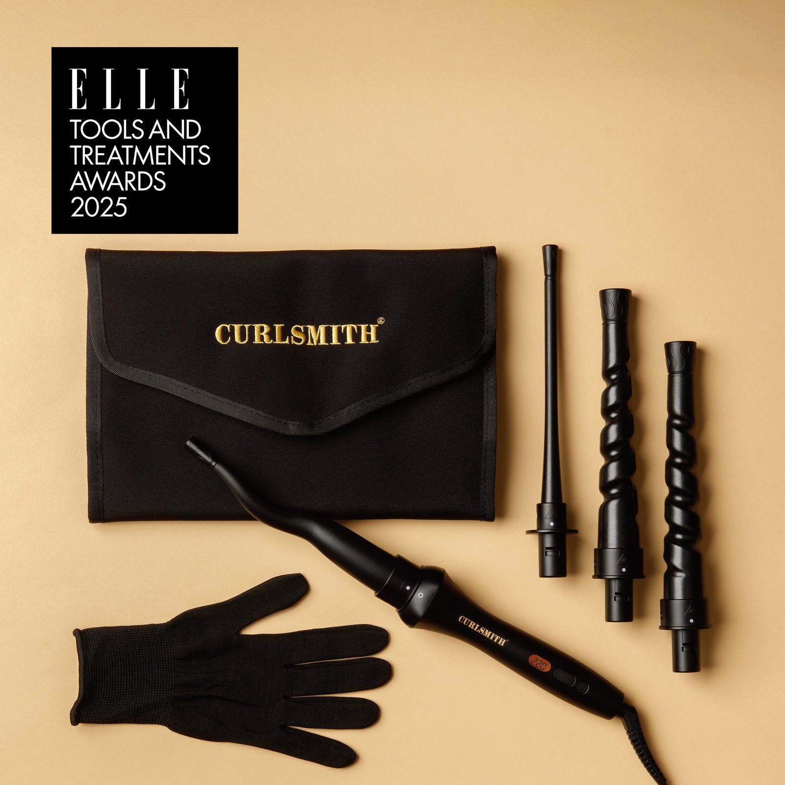 Curlsmith hair styling tools including a black bag, curling iron, and three attachments on a beige background with ELLE Tools and Treatments Award logo.