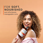 Woman holding a bottle of hair care product with text on a peach background