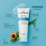 Curlsmith In-Shower Style Fixer tube with product features on a blue background