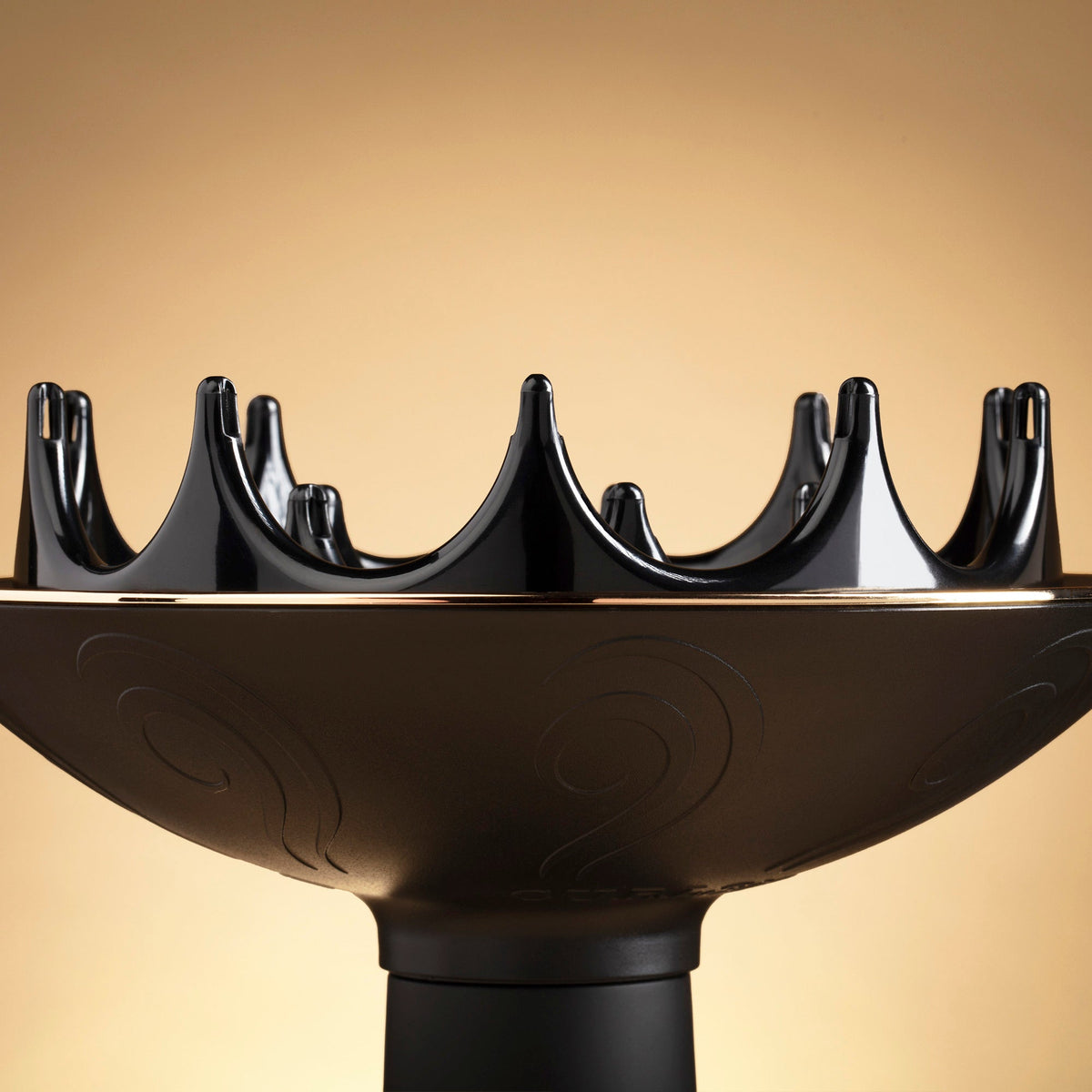Black hair dryer nozzle on a beige background, Click to enlarge